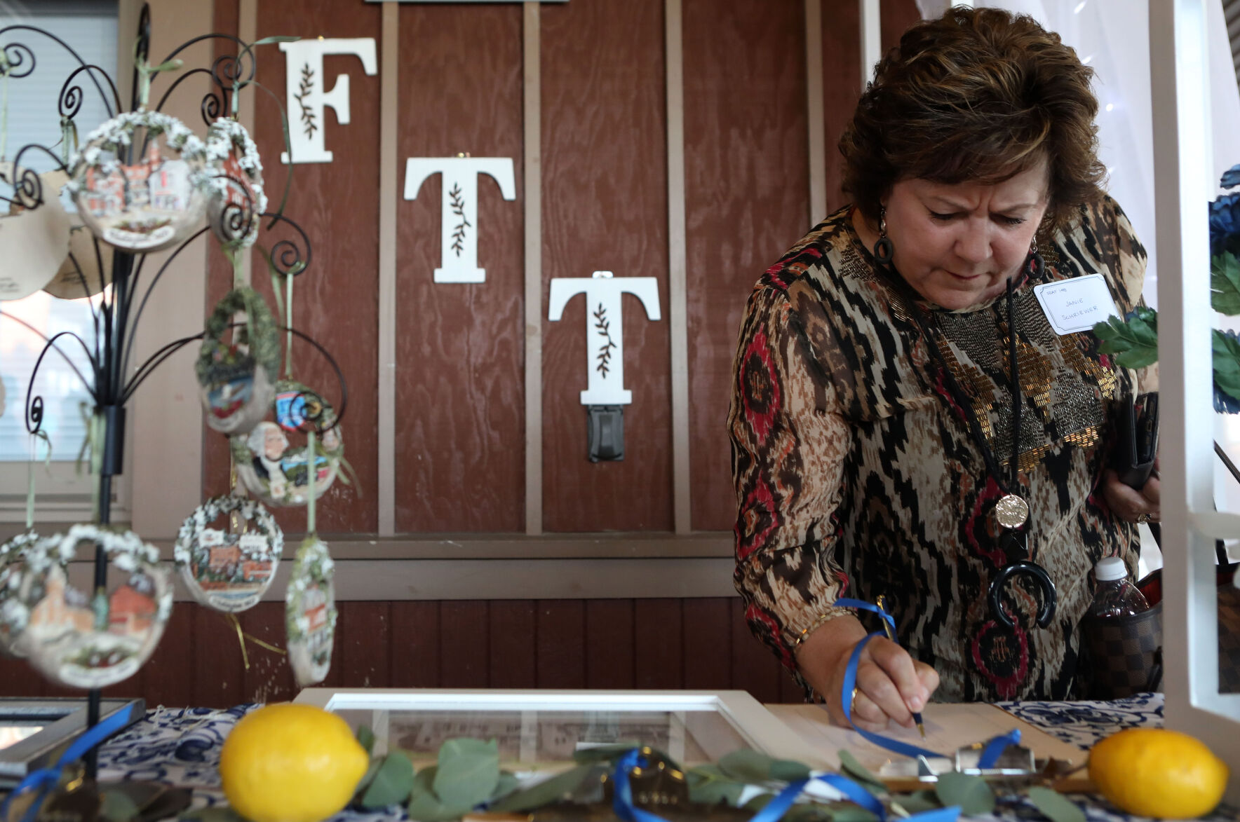 Janie Schriewer bids in silent auction